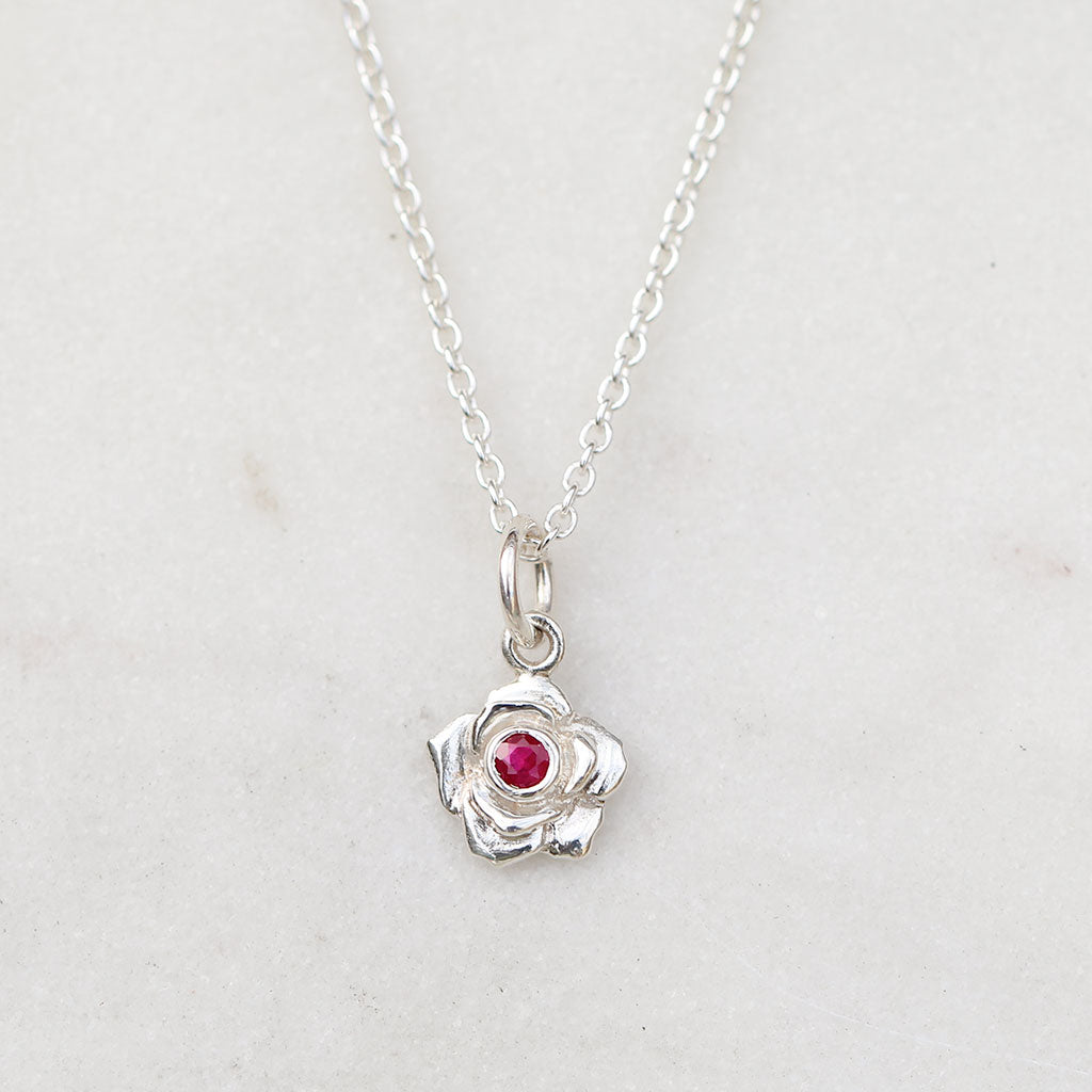 Sterling silver petite rose pendant with a ruby