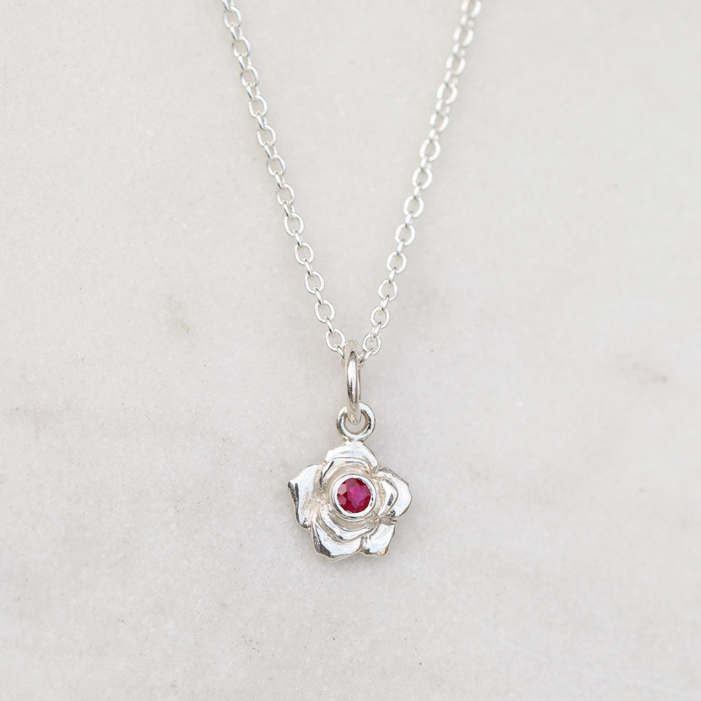 Sterling silver rose pendant with a ruby