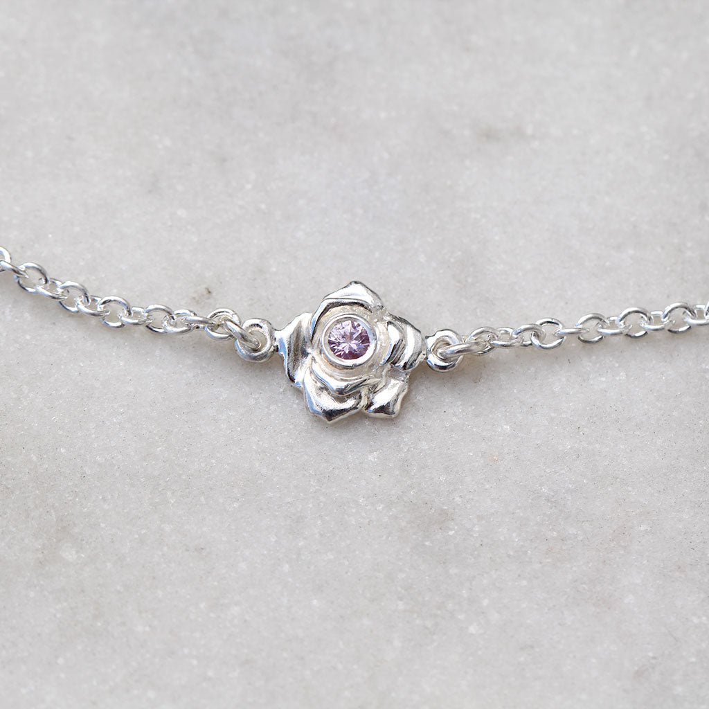 Mini rose bracelet in sterling silver with a pink sapphire