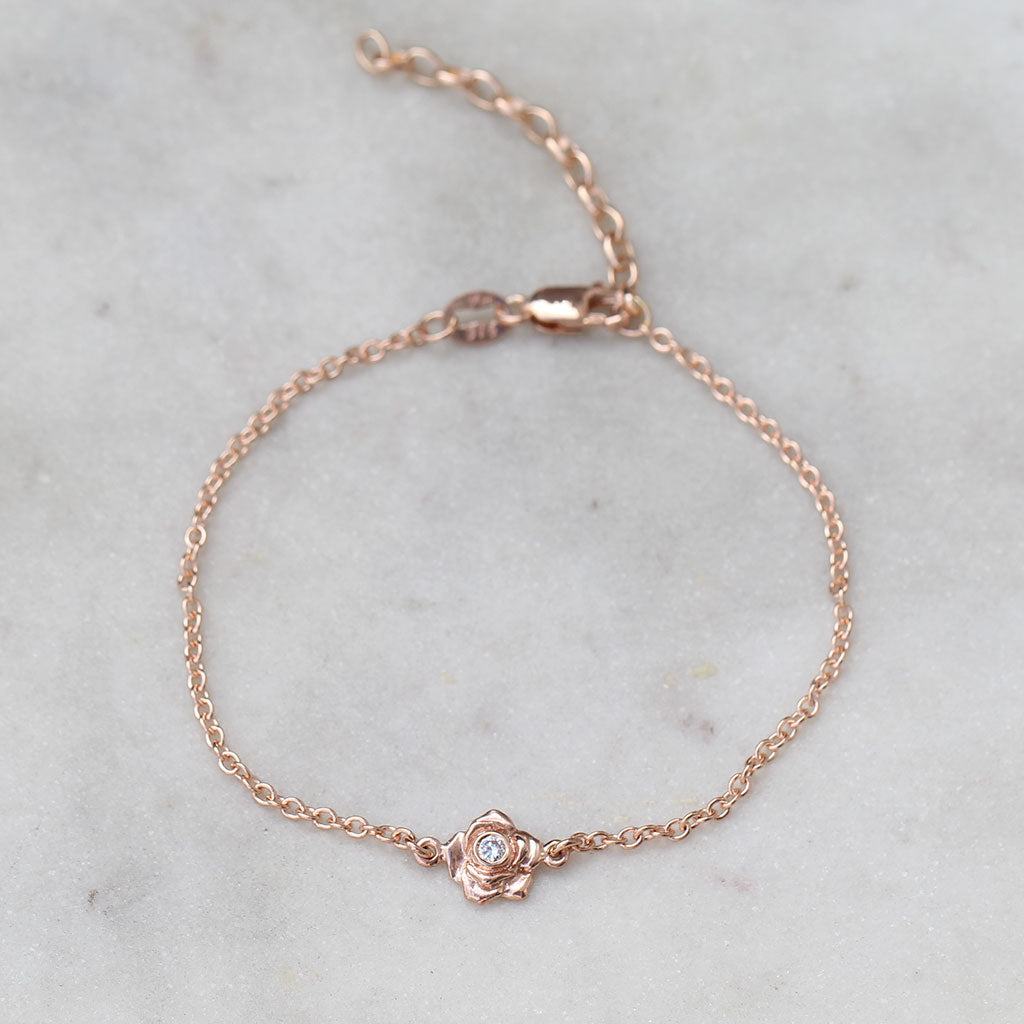 Rose gold rose bracelet with a diamond