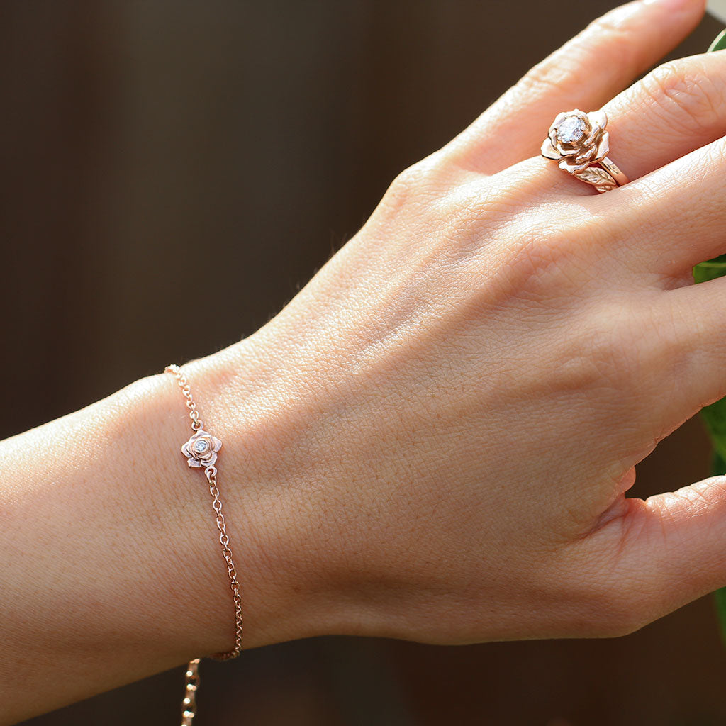 Rose bracelet and a rose ring in rose gold