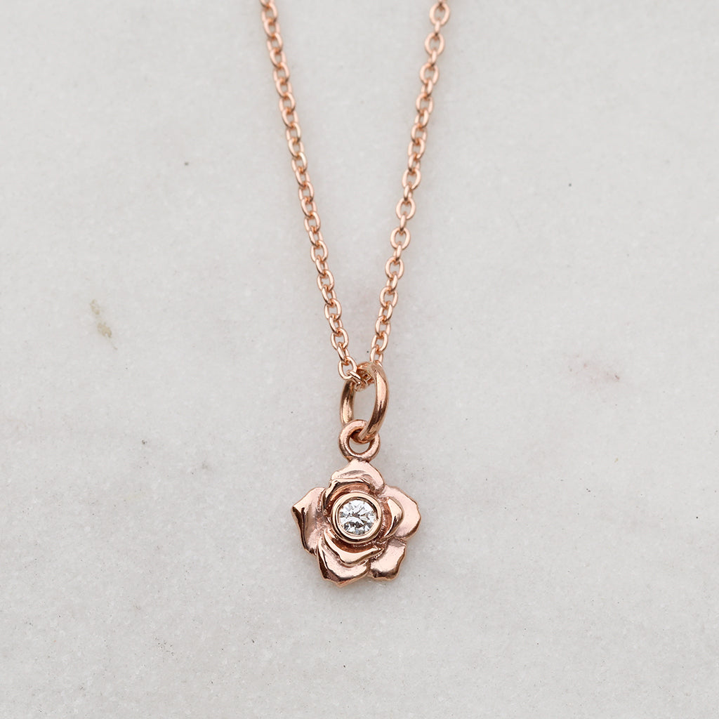 Rose gold rose necklace with a diamond