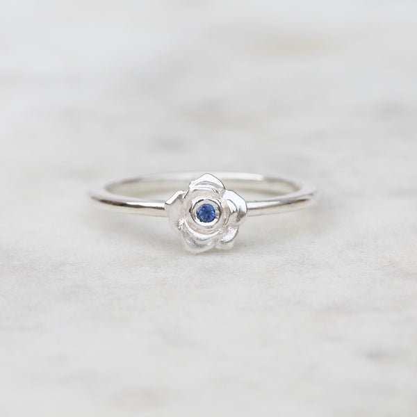 Silver rose ring with a Ceylon blue sapphire