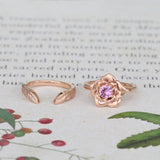 rose engagement ring and leaf wedding ring