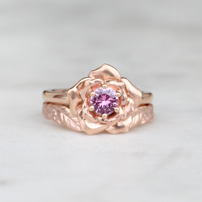 rose engagement ring and leaf wedding ring