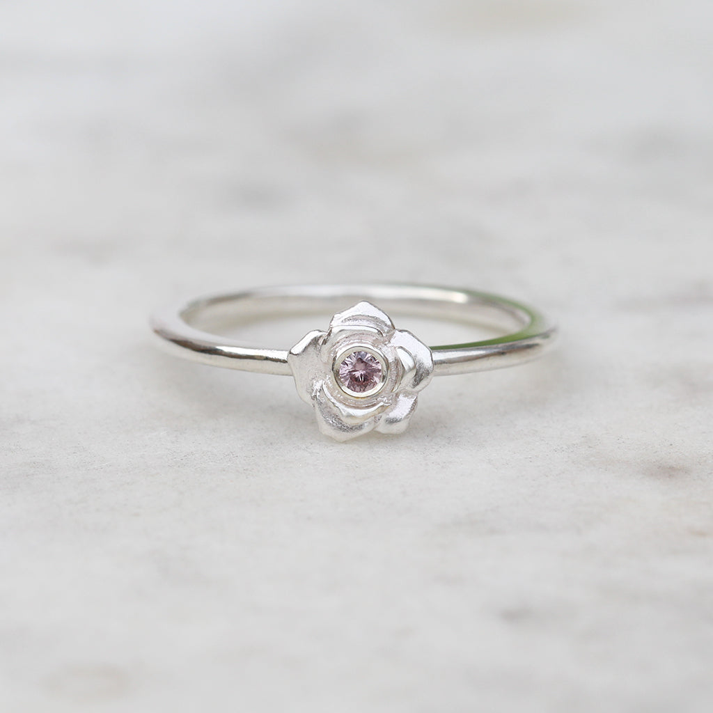 Silver rose ring with a pink sapphire