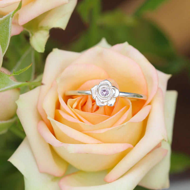 Silver rose ring with a pink sapphire
