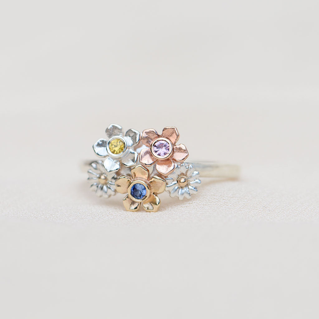 Flower bouquet ring with sapphires