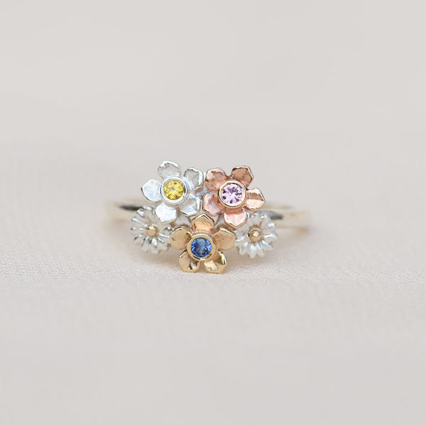 Ring with floral design and multicolored gemstones