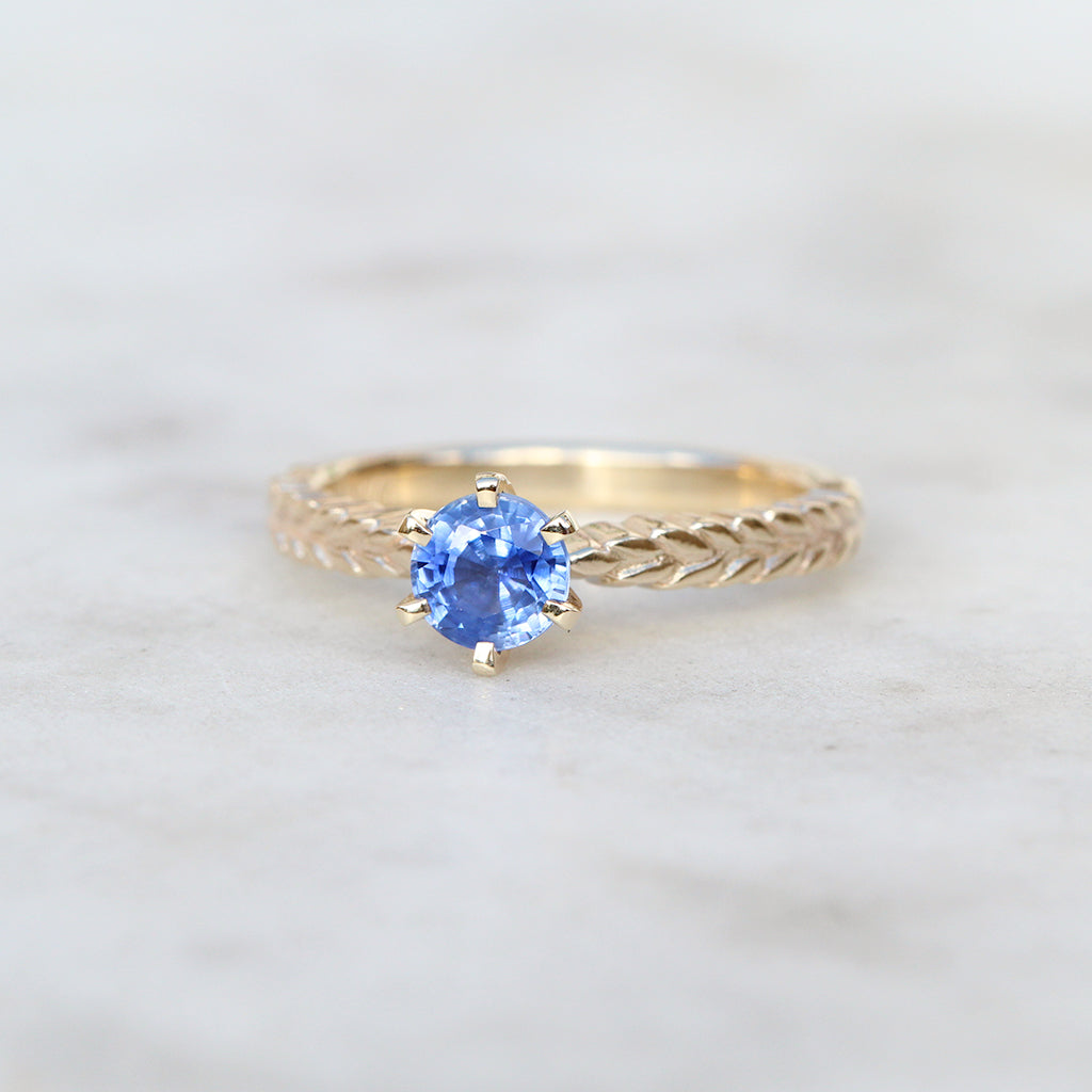 Silver fern dew ring with sapphire