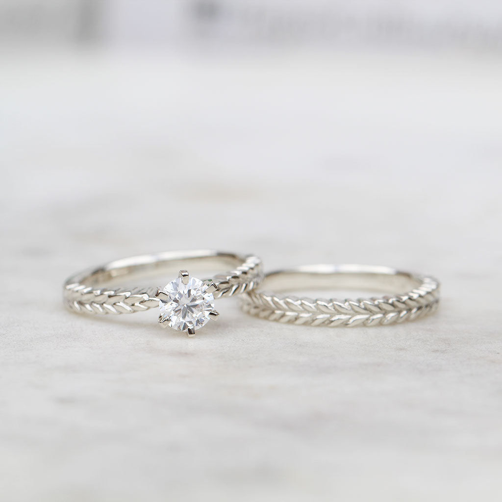 Silver fern engagement ring and silver fern wedding ring in white gold