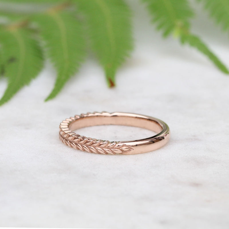Silver fern wedding ring in rose gold