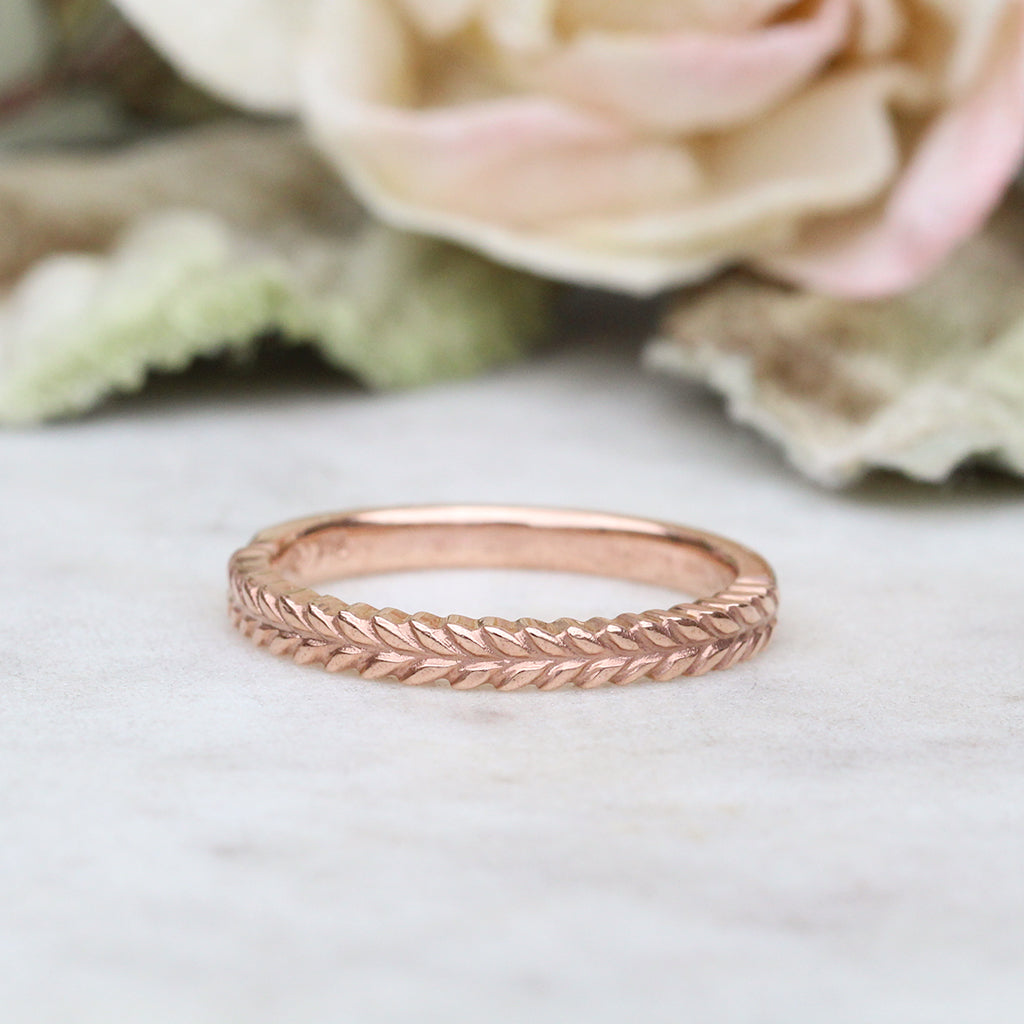 Silver fern wedding ring in rose gold