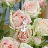 Silver rose on a stem necklace