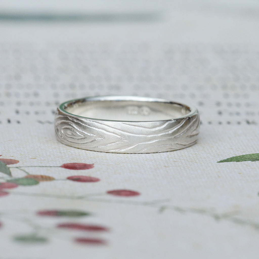 Men's wedding band with tree ring pattern texture