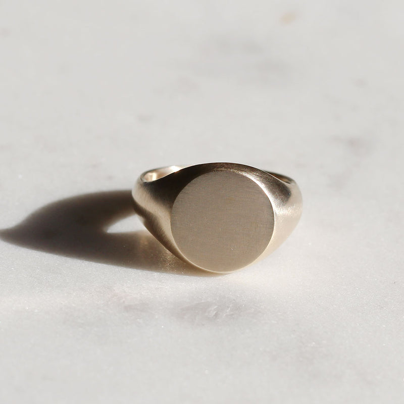 round signet ring in gold