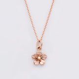 forget me not necklace in rose gold