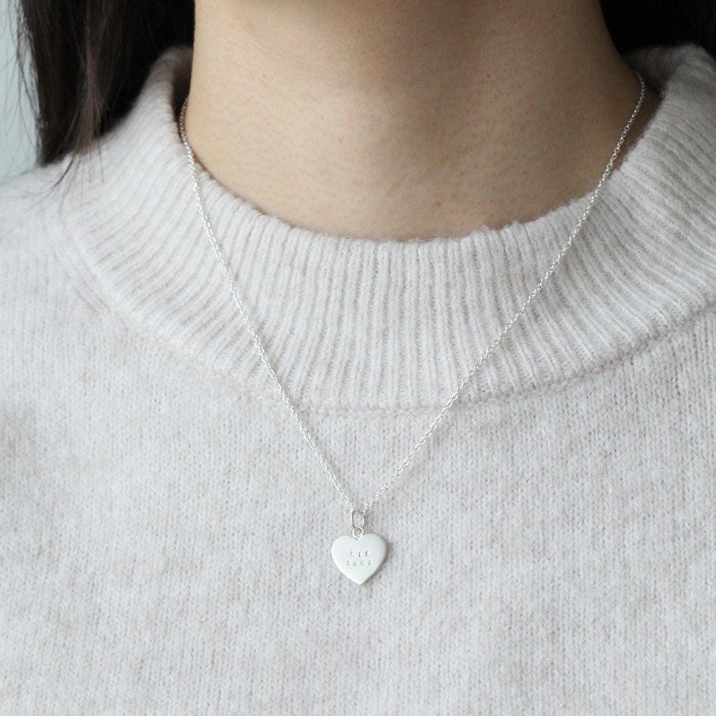 kia kaha stamped heart necklace in silver