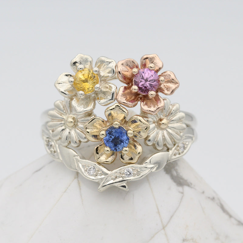olive wedding ring and flower bouquet ring