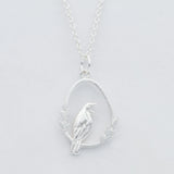 silver tui bird necklace