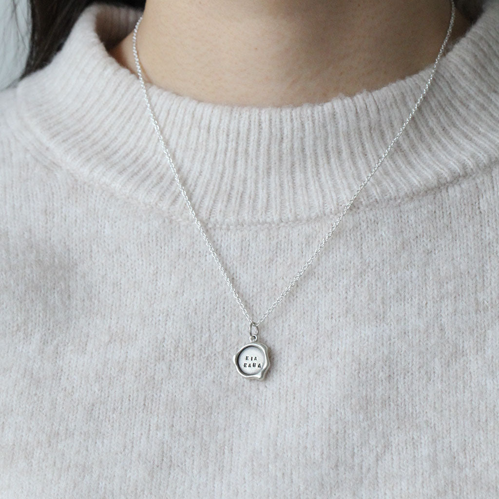 kia kaha wax seal necklace in silver